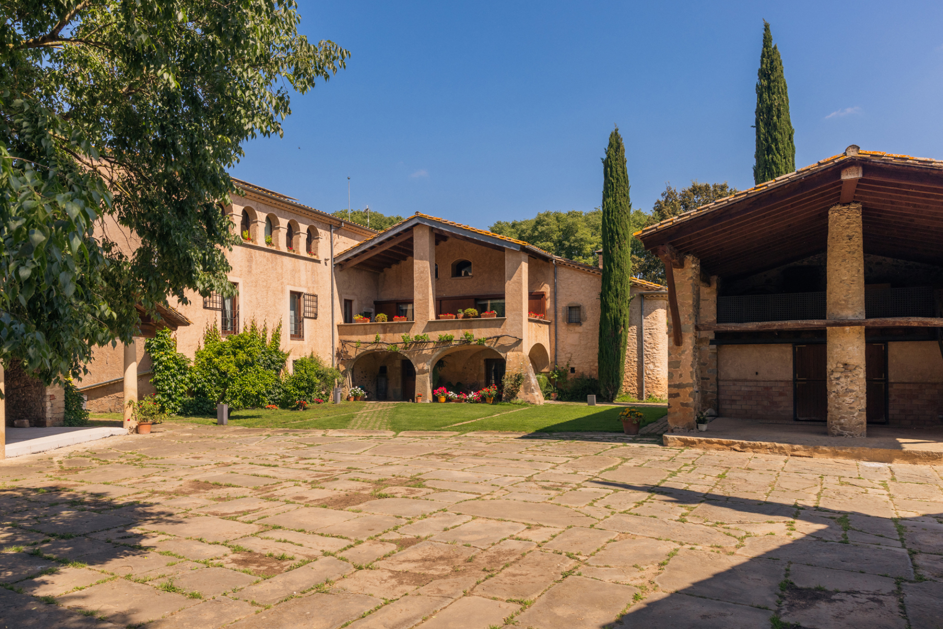 The stone courtyard of Mas Simon, a restored farmhouse near Girona